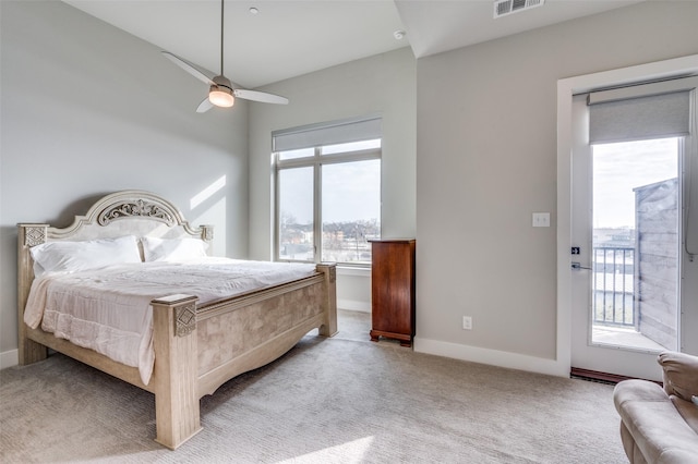 carpeted bedroom with ceiling fan and access to outside