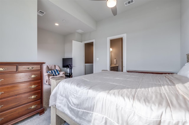 carpeted bedroom with connected bathroom and ceiling fan