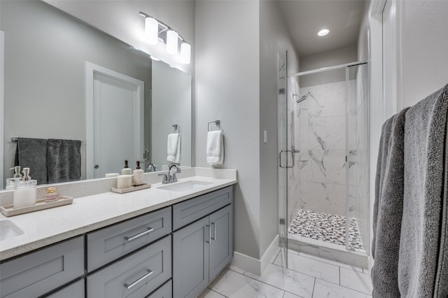 bathroom featuring vanity and a shower with shower door