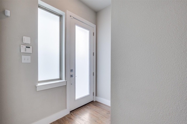 doorway with light hardwood / wood-style floors