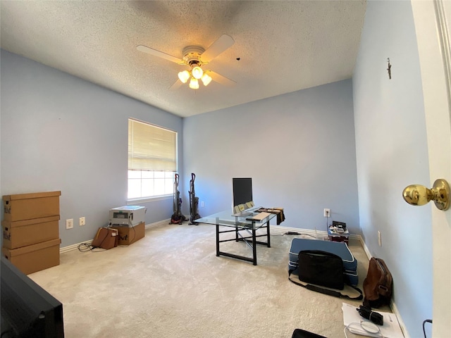 interior space with ceiling fan and a textured ceiling