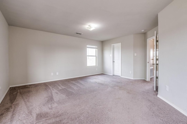 unfurnished room featuring carpet floors