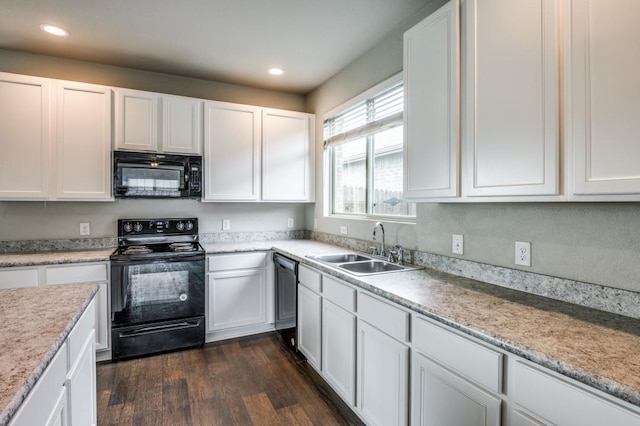 kitchen with dark wood-type flooring, white cabinets, sink, and black appliances