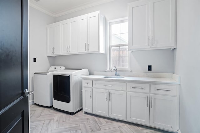 washroom featuring sink, cabinets, washer and dryer, ornamental molding, and light parquet flooring