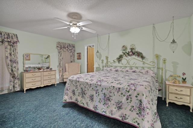 bedroom with dark colored carpet, a textured ceiling, and ceiling fan