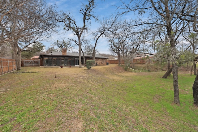 view of yard with a sunroom