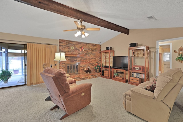 carpeted living room with lofted ceiling with beams, ceiling fan, a brick fireplace, and a textured ceiling