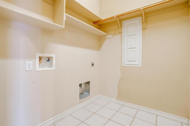 630 Celeste Ln, Burleson, TX 76028 - washroom featuring hookup for an electric dryer, washer hookup, baseboards, and light tile patterned flooring