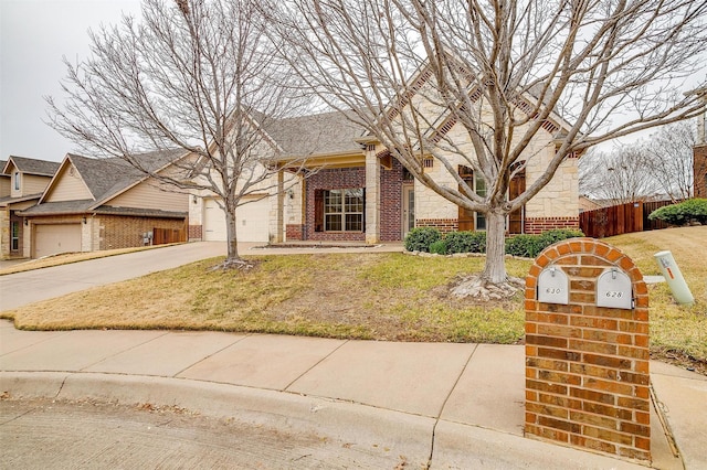 view of front of home with a garage and a front lawn