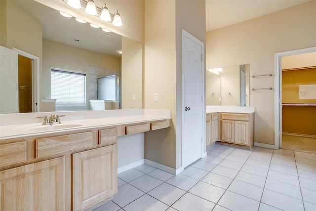 bathroom with tile patterned flooring and vanity