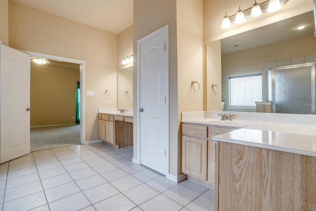 bathroom with vanity, tile patterned floors, and walk in shower