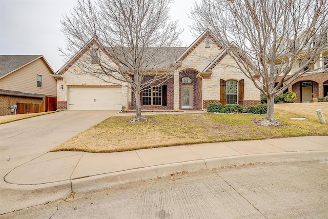 view of front of home with a garage and a front yard