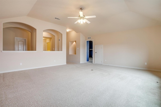 carpeted empty room with vaulted ceiling and ceiling fan