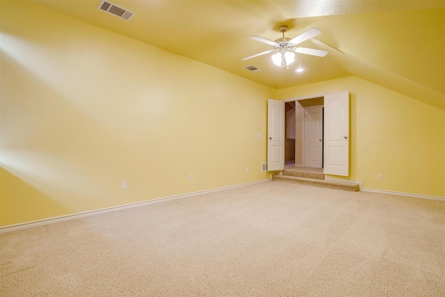 unfurnished bedroom with lofted ceiling, carpet floors, and ceiling fan