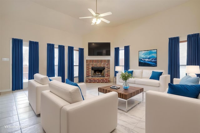 630 Celeste Ln, Burleson, TX 76028 - living area with plenty of natural light, ceiling fan, vaulted ceiling, a fireplace, and baseboards
