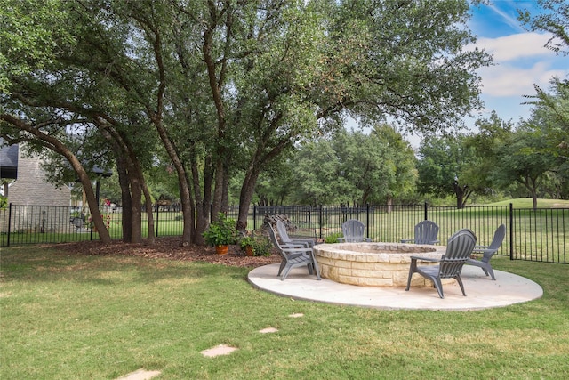 view of yard with a patio area and an outdoor fire pit