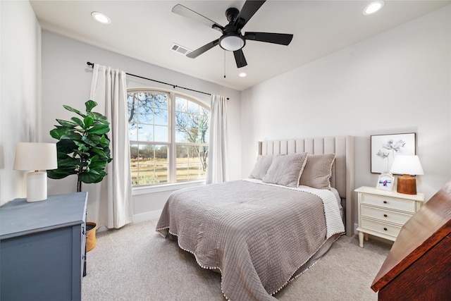 bedroom featuring ceiling fan and light colored carpet