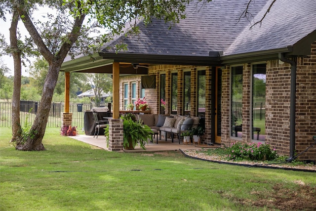 view of patio / terrace featuring an outdoor living space and ceiling fan