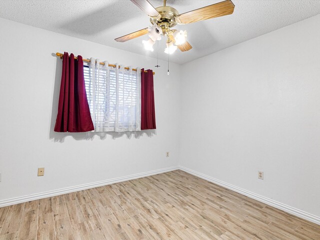 unfurnished bedroom with ceiling fan, a textured ceiling, and light wood-type flooring