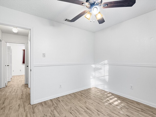 unfurnished sunroom with ceiling fan