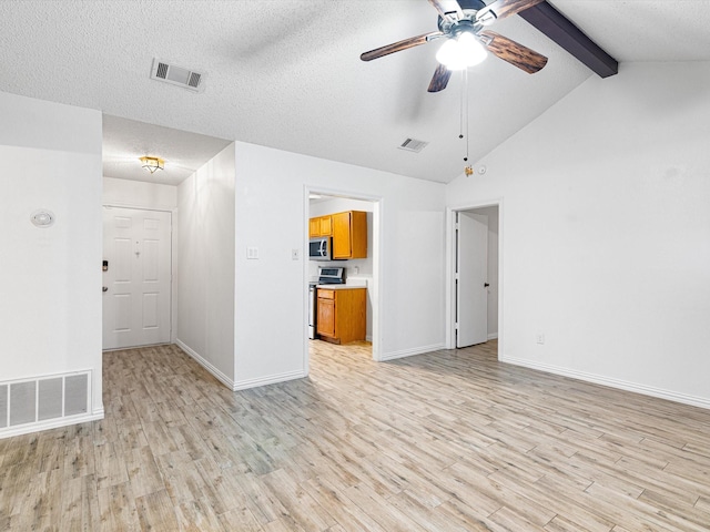 unfurnished living room with ceiling fan, lofted ceiling with beams, a textured ceiling, and light wood-type flooring