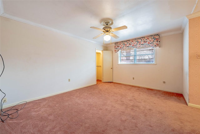 unfurnished room with a ceiling fan, baseboards, crown molding, and light colored carpet