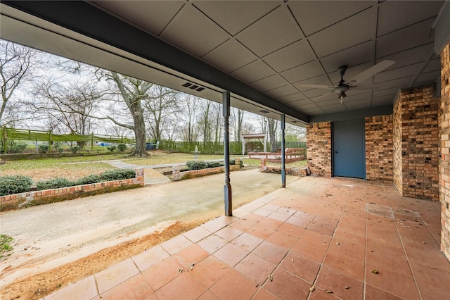 view of patio featuring ceiling fan