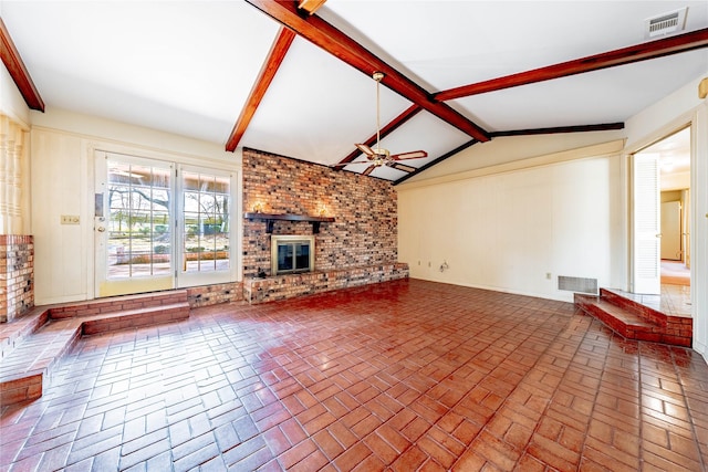 unfurnished living room featuring brick floor, visible vents, lofted ceiling with beams, a brick fireplace, and ceiling fan