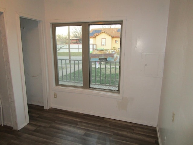 unfurnished room featuring dark hardwood / wood-style flooring