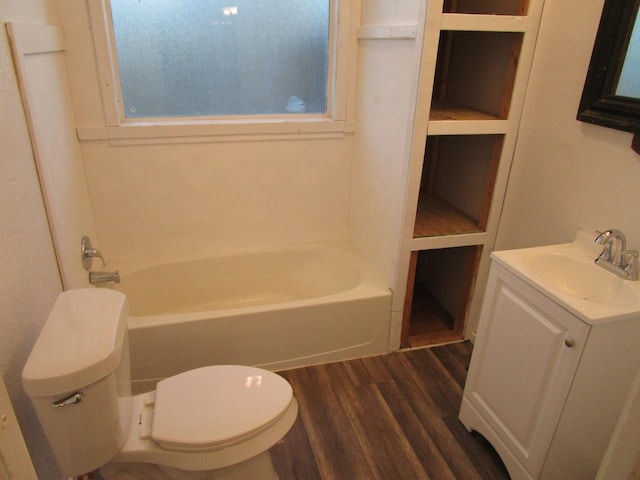 full bathroom featuring wood-type flooring, shower / washtub combination, vanity, and toilet