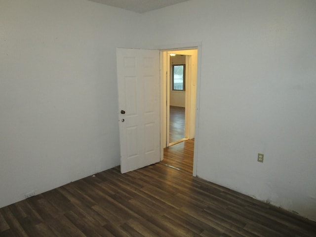 spare room featuring dark hardwood / wood-style floors