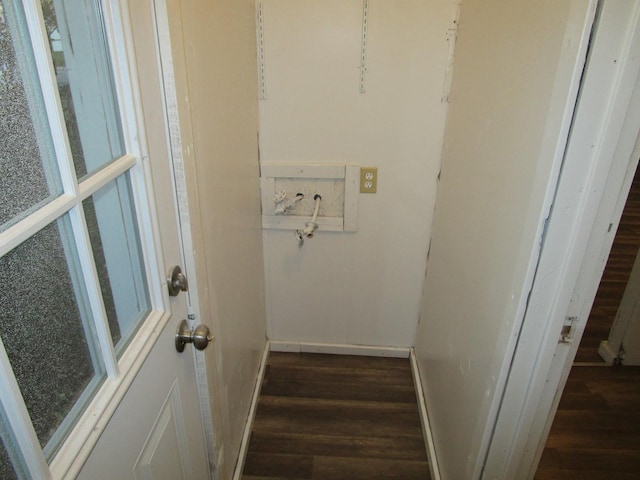 clothes washing area featuring dark hardwood / wood-style flooring