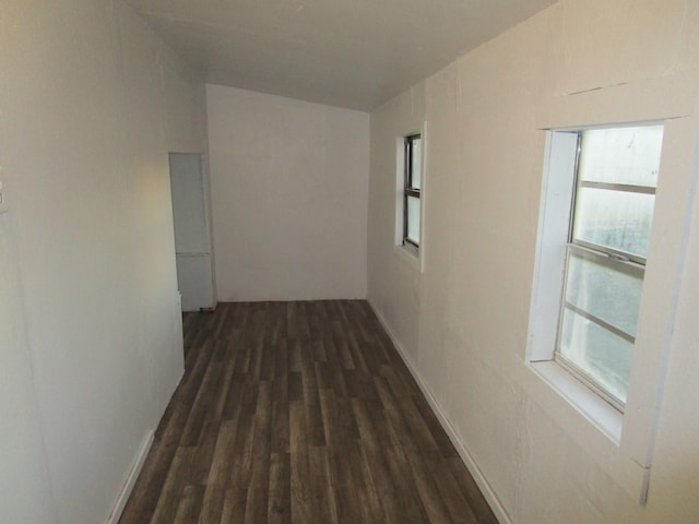 hallway with dark hardwood / wood-style floors