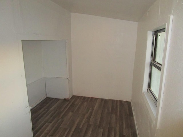 spare room featuring dark hardwood / wood-style floors