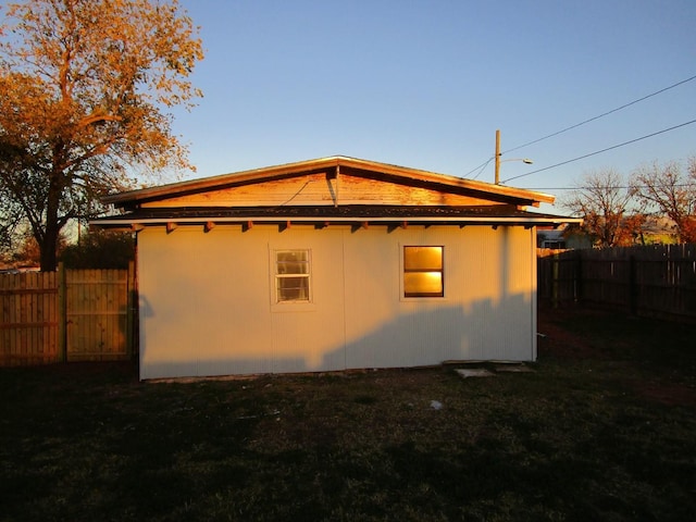 view of property exterior with a yard