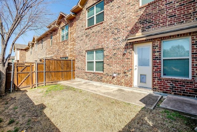 rear view of property featuring a lawn