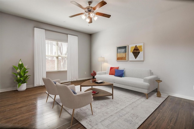 living room with ceiling fan and dark hardwood / wood-style floors