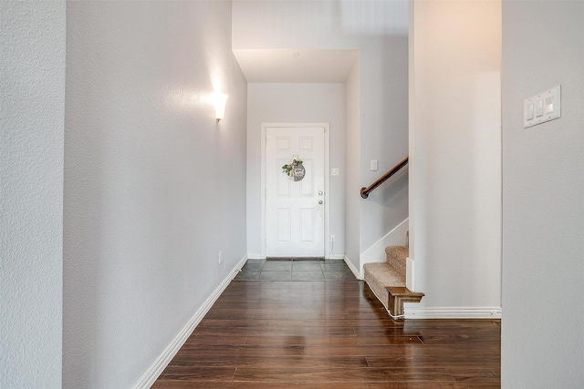 entrance foyer with dark hardwood / wood-style floors