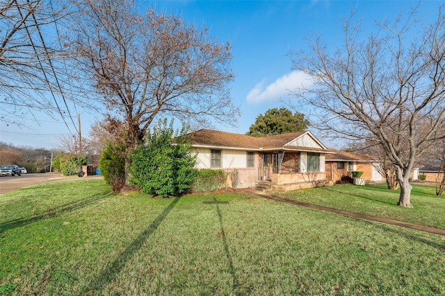 ranch-style house with a front yard