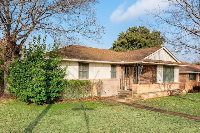 ranch-style home with a front lawn