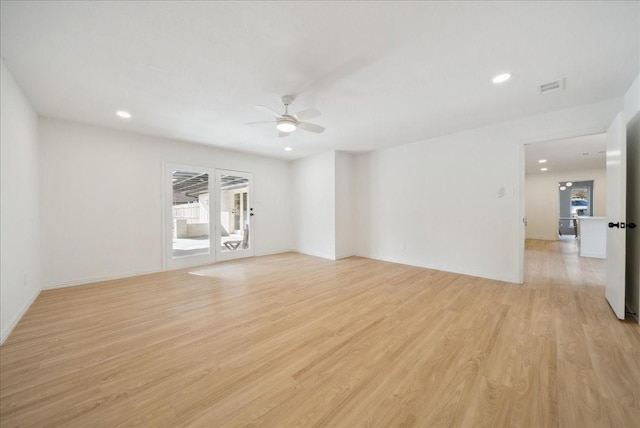 empty room with ceiling fan and light wood-type flooring