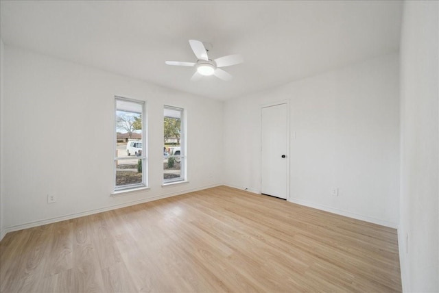 spare room featuring ceiling fan and light hardwood / wood-style floors