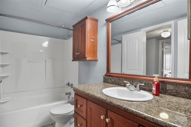 full bathroom featuring vanity, toilet, and washtub / shower combination