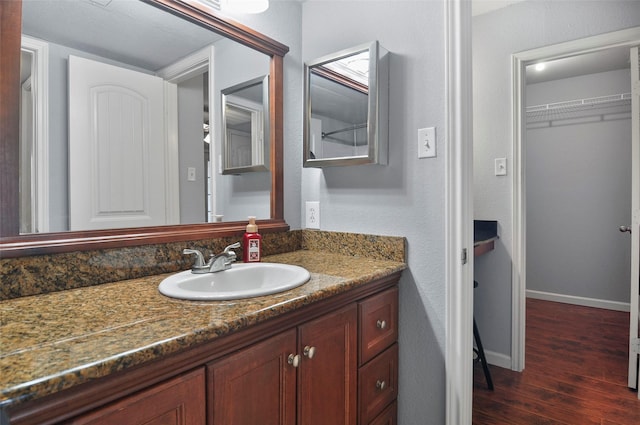 bathroom featuring vanity and wood-type flooring