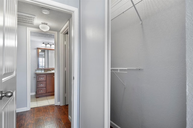 bathroom with wood-type flooring and vanity