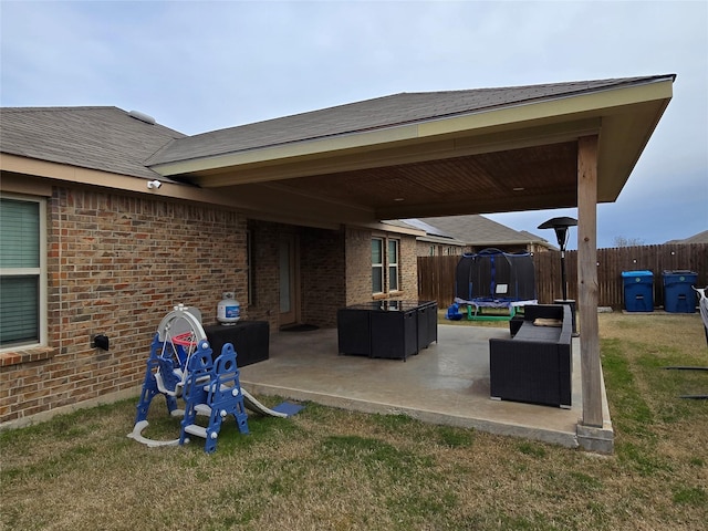 view of patio featuring a trampoline and outdoor lounge area