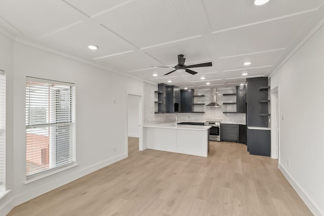 unfurnished living room with coffered ceiling, sink, light hardwood / wood-style flooring, and ceiling fan