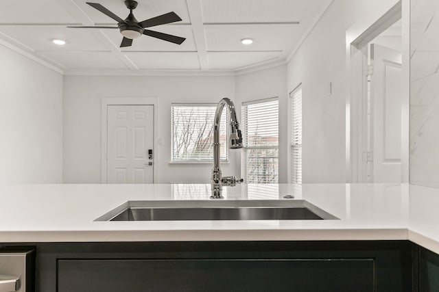 room details with coffered ceiling, sink, crown molding, and ceiling fan