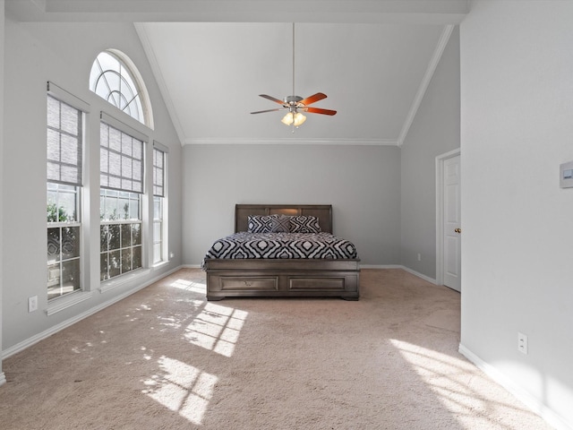 carpeted bedroom with ceiling fan, ornamental molding, and high vaulted ceiling