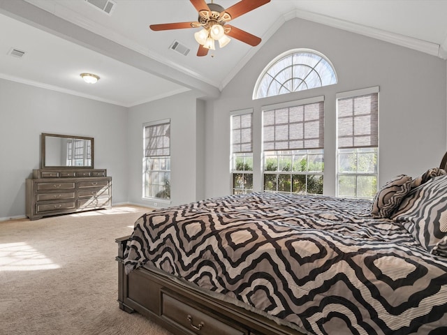 carpeted bedroom with crown molding, vaulted ceiling, and ceiling fan